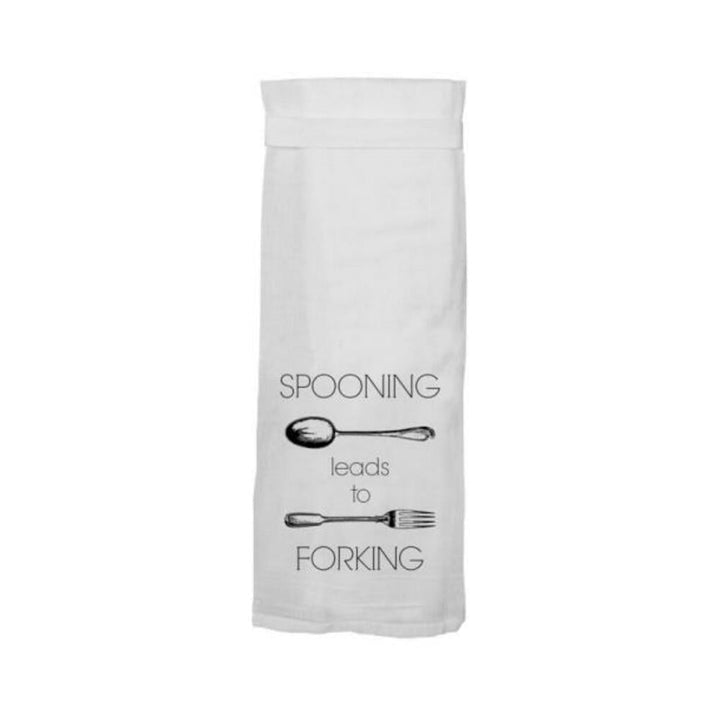 White flour sack towel with black text and illustrations reading "Spooning leads to Forking" featuring a spoon and fork design.