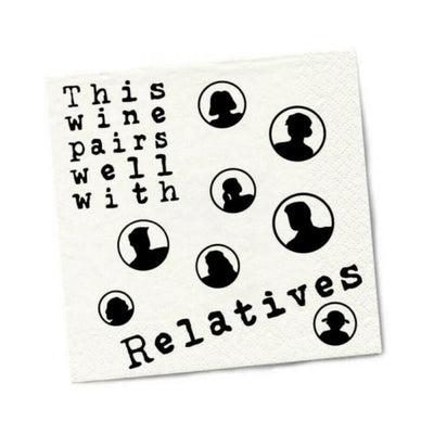 White beverage napkin with black text "This wine pairs well with Relatives" and silhouette family portraits in circles.
