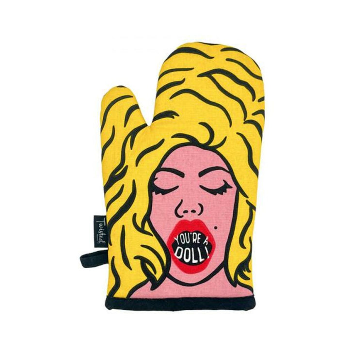 Yellow oven mitt with a pop art style blonde woman and red lips saying "You're A Doll" on the front.