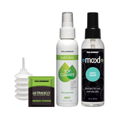 Doc Johnson cleaning and care set with toy cleaner spray, water-based lubricant, refresh powder, and a small applicator bottle.