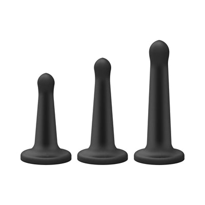 Set of three black silicone pegging attachments in small, medium, and large sizes with flared bases.