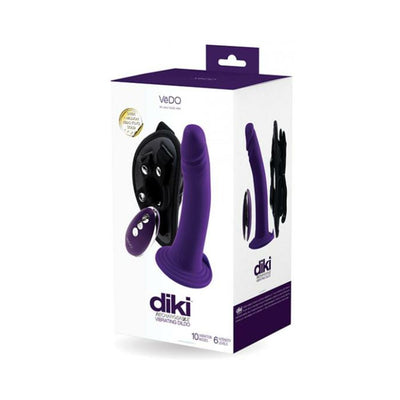 Packaging box of Vedo Diki rechargeable vibrating dildo in deep purple with harness and remote control shown.