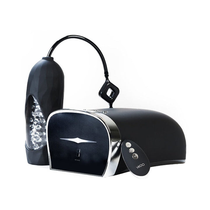 Vedo Hummer 2.0 hands-free BJ machine with sleek black main unit, textured sleeve, and compact remote control.