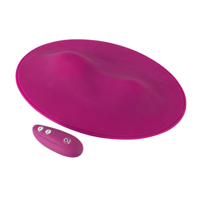 Magenta oval-shaped silicone VibePad with ergonomic contours and matching remote control for customizable vibration.