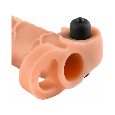 Light-colored vibrating 1-inch extension sleeve with dual rings and textured lifelike design.