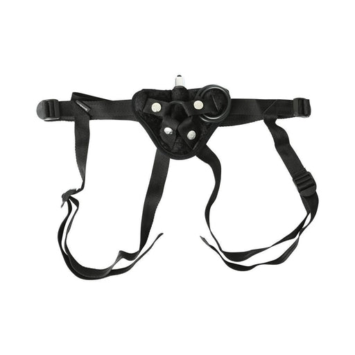 Black velvet strap-on harness with adjustable straps and interchangeable O-ring attachments.
