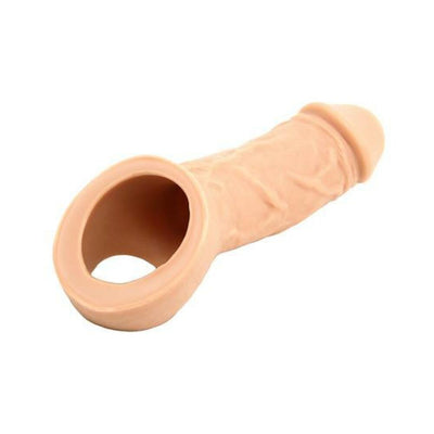 Vixen Creations Holster PPA Extension in flesh tone with hollow design and testicle strap for comfort and support.