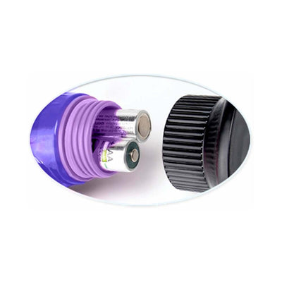 Close-up of purple vibrator showing battery compartment with two AAA batteries inserted and black screw-on cap removed.