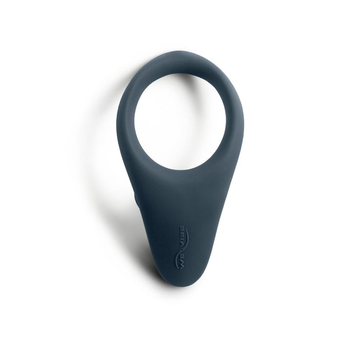 Slate blue We-Vibe Verge vibrating silicone ring with ergonomic design and discreet logo on white background.