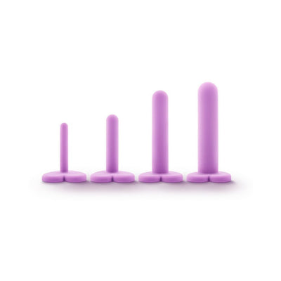 Set of four purple silicone wellness dilators in graduated sizes with heart-shaped bases on a white background.