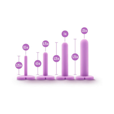 Set of four purple silicone wellness dilators in graduated sizes with heart-shaped bases and size labels.