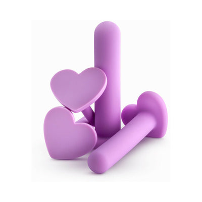 Set of four purple silicone vaginal dilators with heart-shaped bases in varying sizes on white background