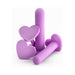 Set of four purple silicone vaginal dilators with heart-shaped bases in varying sizes on white background