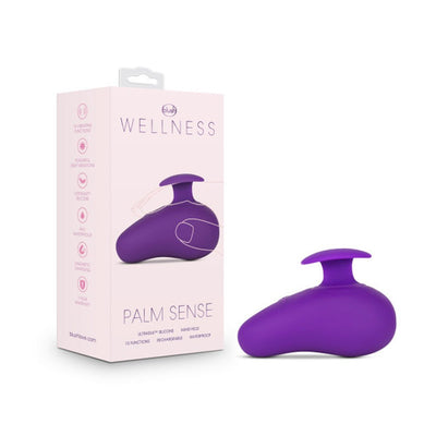 Purple Wellness Palm Sense handheld massager with ergonomic finger fin and packaging box on white background.