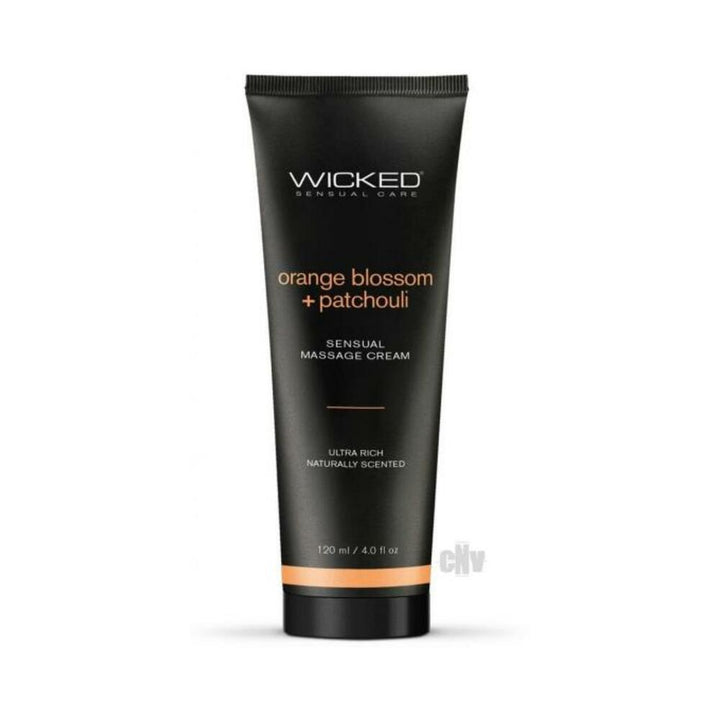 Black tube of Wicked Orange Blossom + Patchouli sensual massage cream with orange accents, 4 oz.