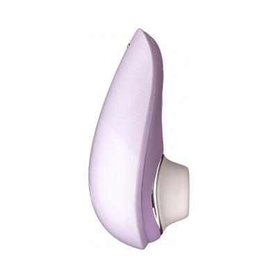 Compact Womanizer Liberty clitoral stimulator in soft lavender with white silicone head and sleek ergonomic design.