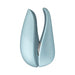 Compact light blue Womanizer Liberty clitoral stimulator with sleek curved design and two interchangeable heads.