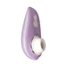Compact Womanizer Liberty clitoral stimulator in lavender with white silicone head and plus/minus control buttons.