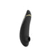 Black Womanizer Premium 2 clitoral stimulator with sleek curved design and gold accent stripe.