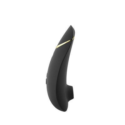 Black Womanizer Premium 2 clitoral stimulator with gold accent and ergonomic curved design on white background.