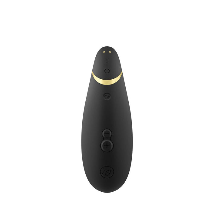 Black Womanizer Premium 2 clitoral stimulator with gold accent and control buttons on a white background.