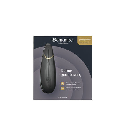 Womanizer Premium 2 clitoral stimulator in sleek black with gold accent, displayed on its elegant packaging box.