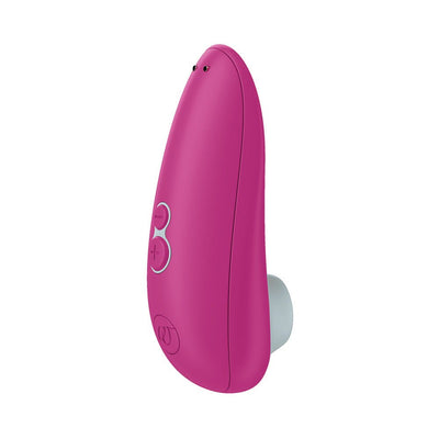 Pink Womanizer Starlet 3 clitoral stimulator with ergonomic design and control buttons on the side.
