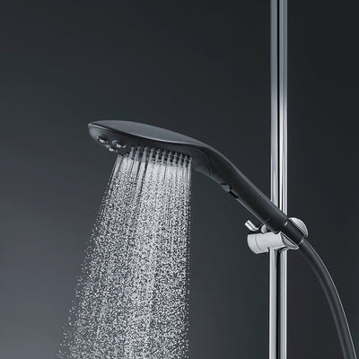 Sleek black Womanizer Wave shower head releasing a fine spray of water, mounted on a chrome shower rail.