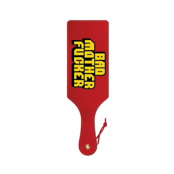 Red paddle with bold yellow and black "Bad Mother Fucker" text and a wrist strap for playful adult use.