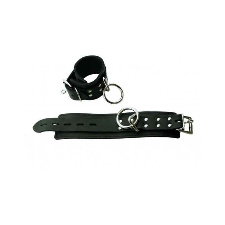 Black leather wrist restraints with plush faux fur lining and metal D-rings, adjustable buckle closure.