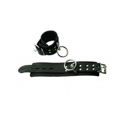 Black leather wrist restraints with plush faux fur lining and metal D-rings, adjustable buckle closure.