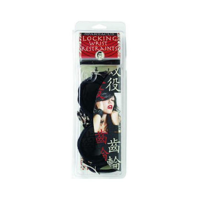 Black faux fur-lined leather wrist restraints in clear retail packaging with product label and artistic image.