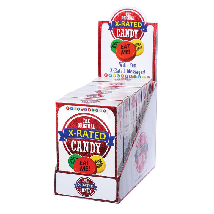 Display box of six X-Rated Candy packs featuring colorful fruit-flavored tart candies with playful messages.