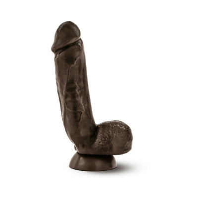 Realistic dark brown dildo with suction cup base standing upright on white background.