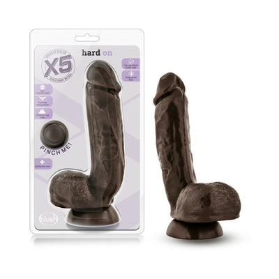 Blush X5 Hard On Dong in natural color with suction cup base shown inside packaging and standing upright outside.