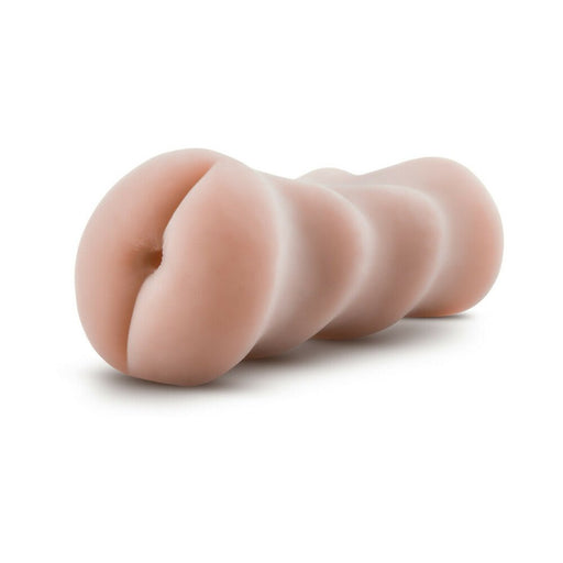 Palm-sized vanilla-colored anal stroker with a textured, flexible design for enhanced sensation.