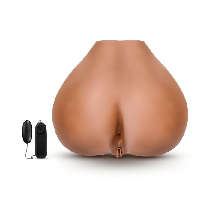 Realistic mocha-colored dual entry male stroker with remote-controlled vibrating bullet on white background.