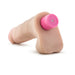 Beige 7-inch realistic vibrating dildo with pink multi-speed control cap on white background.