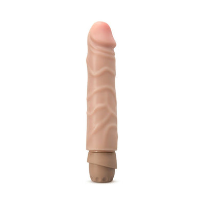Compact realistic vibrator with flexible shaft and multi-speed dial in skin tone finish.