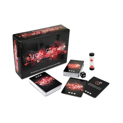 You & Me Couples Card Game box with playing cards, a timer, and a dice featuring romantic symbols and heart designs.
