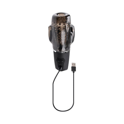 Black smoke rechargeable vibrating stroker with textured inner chamber and USB charging cable on white background.