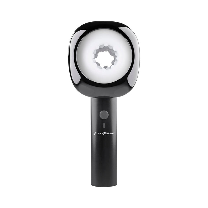 Zero Tolerance Let It Slide rechargeable stroker in black with ergonomic handle and textured white inner sleeve.