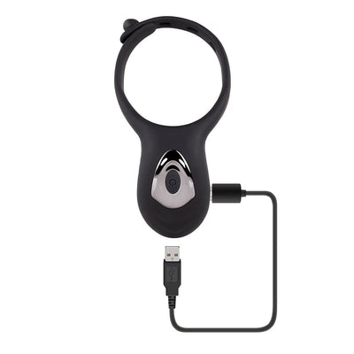 Black silicone adjustable vibrating cockring with remote control and USB charging cable attached.