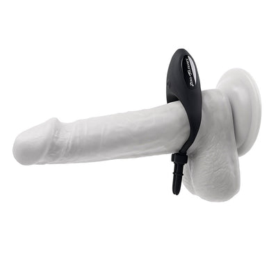 Black adjustable vibrating silicone lasso cockring displayed on a white anatomical model with suction base.