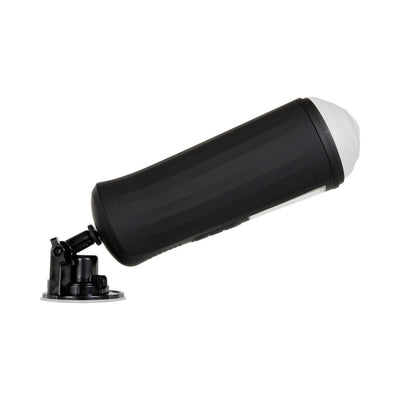 Black cylindrical vibrating and tightening stroker with suction cup base angled for hands-free use on white background