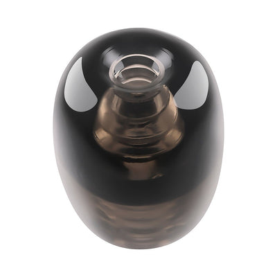 Compact black silicone stroker with a smooth, glossy finish and a small open-ended entry.