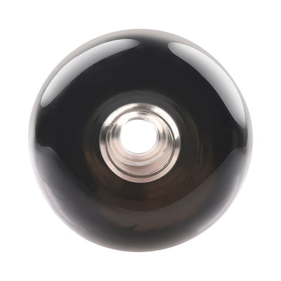 Top view of a sleek black silicone stroker with a central open-ended entry and smooth outer surface.