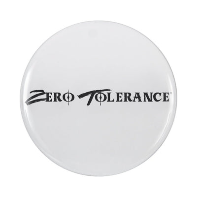 White circular cap with black Zero Tolerance logo printed in bold stylized font.