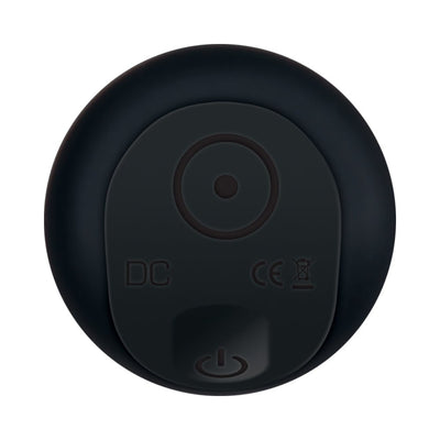 Close-up of the black silicone rechargeable bullet vibrator control panel with power button and charging port.