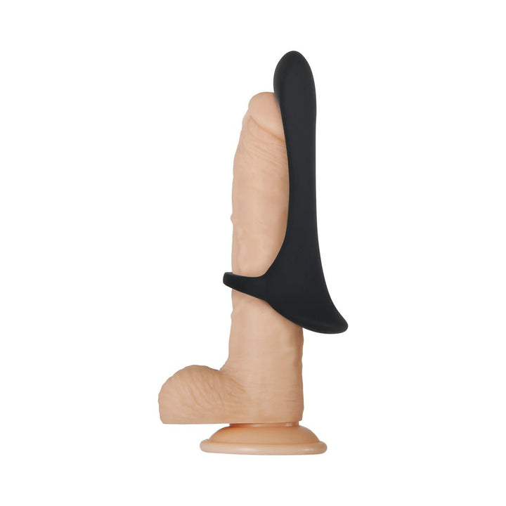 Black silicone cock ring with extended vibrating arm displayed on a realistic flesh-toned model.